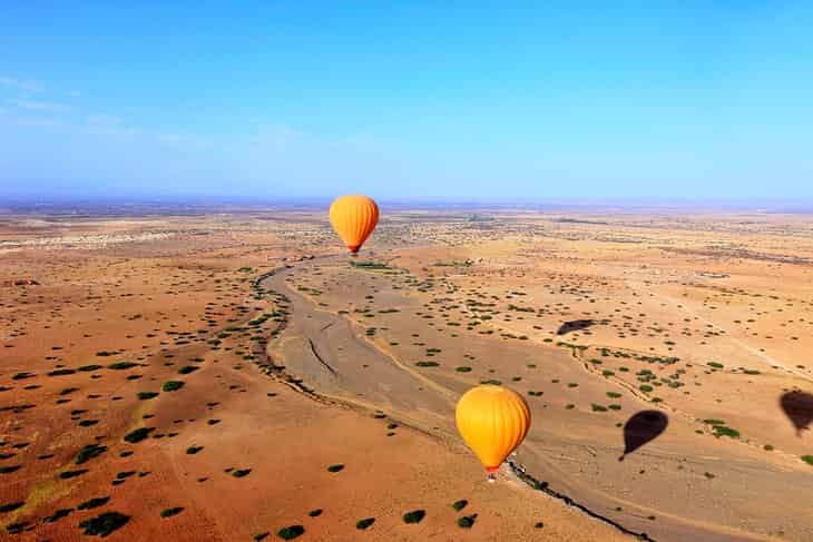 Paseo-en-globo-aerostatico-sobre-la-campina-de-Marrakech Lugares para visitar en Marrakech: rincones imperdibles de la ciudad roja